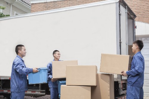 Commercial movers handling desks and IT equipment for a West Kensington office move