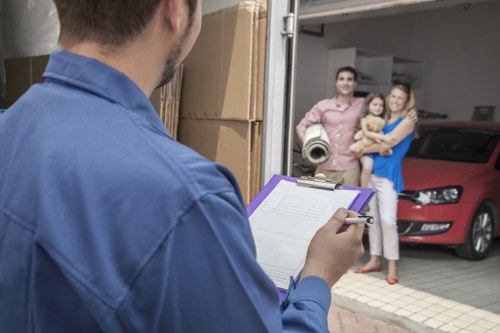 Moving van and household items being loaded for a West Kensington relocation