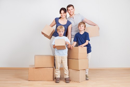 Packed boxes and furniture ready for student removals in West Kensington
