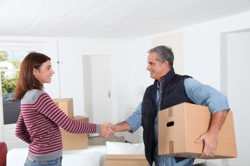 Professional local movers handling boxes and furniture in West Kensington