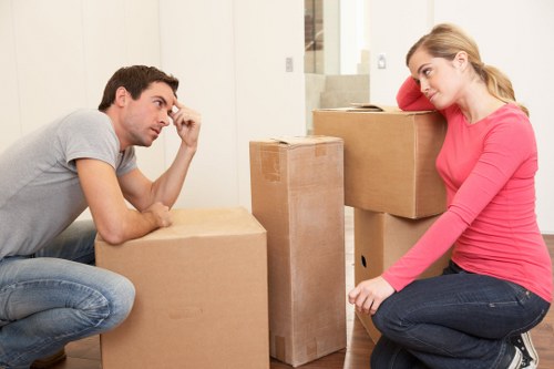 Mover handling fragile items with care and protective equipment