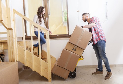 Professional movers handling furniture in a flat move